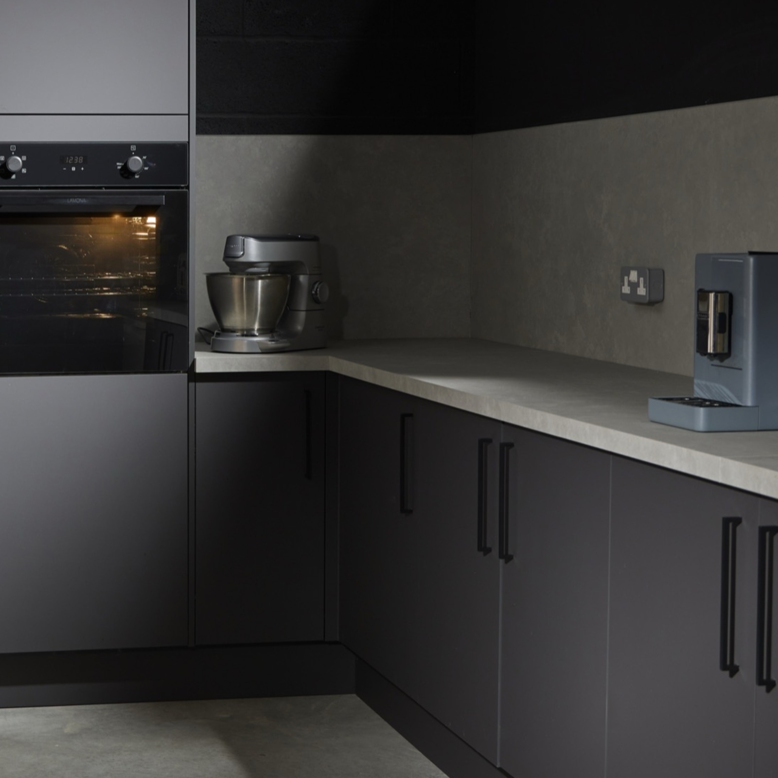 Twin built-in ovens and stand mixer in the production kitchen